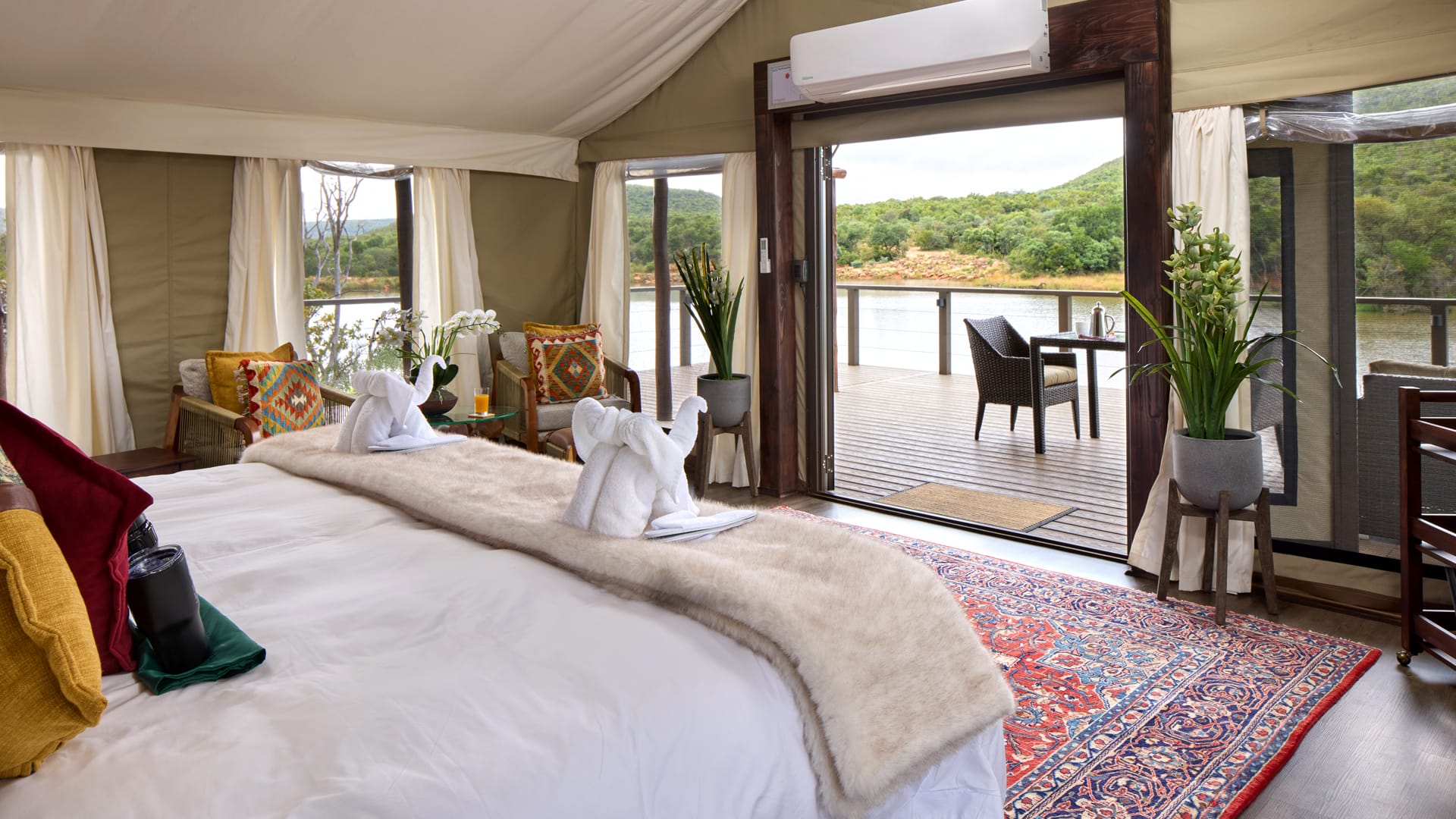 Luxury tented suite at Hippo Lakes opening onto a private deck above the river